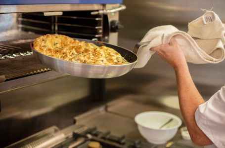 Chef cooking an omelette at Casa di Lusso Dementia Nursing Home Bridgwater Somerset