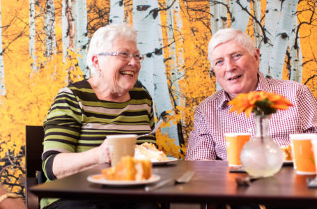 Residents enjoying tea and cake in the cafe at Casa di Lusso Care Home Bridgwater Somerset