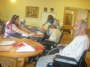 Residents making Poppy art with Creative Minds