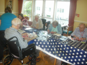 Residents making Poppy art with Creative Minds