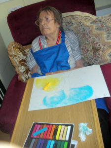 Resident colouring in her butterfly artwork
