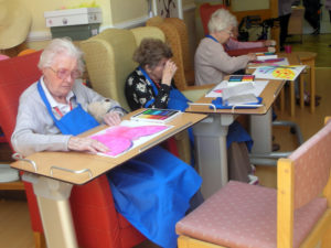Residents colouring in their butterflies