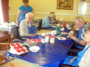 Residents making Poppy art with Creative Minds
