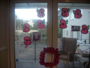 Clarence Park's window display of their home made poppy art and poppy wreath