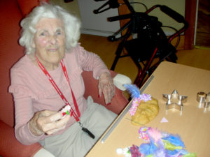 Resident flower arranging with home made playdough