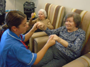 staff dancing with resident