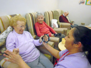 staff dancing with resident