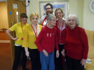 Residents and staff wearing red or yellow for Dementia Awareness Week