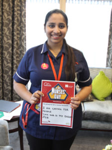 Casa di Lusso nurse holding her 'what makes her proud to be a nurse' statement