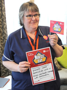 Casa di Lusso nurse holding her 'what makes her proud to be a nurse' statement
