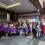 Reminiscence Learning staff, Archie pictured together with Notaro Care Home residents, other sponsors and attendees