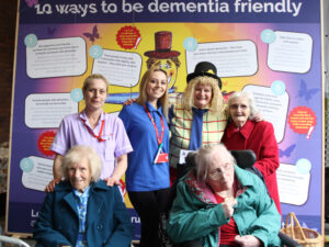 Immacolata House residents and staff pictured with Archie