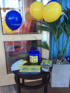 Table set up with St Margaret's Hospice Collection box, leaflets and balloons