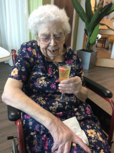 Casa di Lusso resident enjoying a glass of fizz in the beauty room