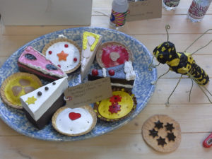 Immacolata House resident's finished clay cakes, presented on a plate