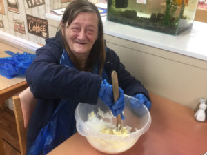 Campania resident mixing the cake mix