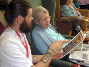 Clarence Park Resident and staff choosing they style of cake they would like to bake