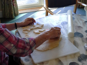 Resident making cookies for halloween