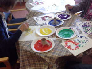 Making firework paintings with toilet cut up cardboard toilet roll tubes