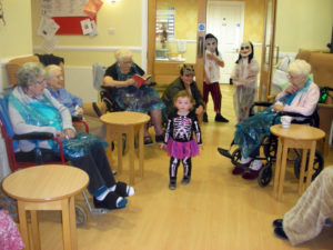 Children dressed up for halloween meeting the residents at Clarence Park