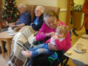 Clarence Park resident meeting & holding a toddler