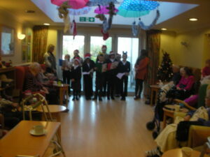 Bournville School Pupils singing carols to residents