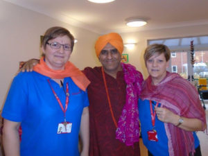 Avtar Indian Dance troop teacher, with Aspen Court's activities team, dressed in Indian Head scarfs