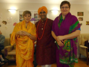 Avtar Indian Dance troop teacher, with Aspen Court's activities team, dressed in full Indian costume