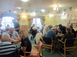 Immacolata House residents and loved ones sat at their tables enjoying the Christmas Party Buffet Lunch