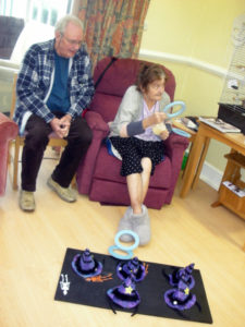 Resident throwing hoop onto witch's hat