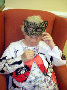 Resident wearing a leopard Cat mask