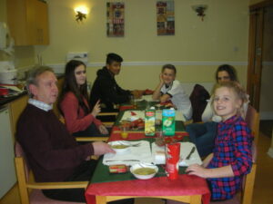 Resident's grandchildren sat at the table enjoying Christmas Day Lunch