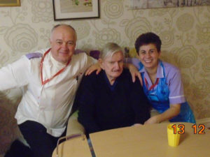 Aspen Court resident with staff members