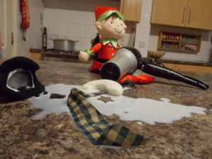Christmas Elf melting Frosty the Snowman with the hair dryer!