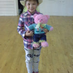 King Ina school pupil dressed as a scarecrow with her teddy also dressed up