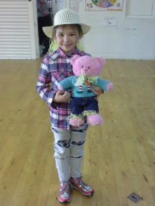 King Ina school pupil dressed as a scarecrow with her teddy also dressed up