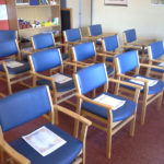 Remembrance service sheets laid out on the chairs