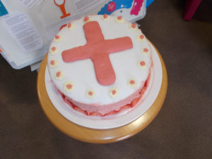 Home made cake decorated with a red cross for the Nurses
