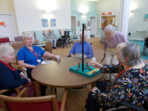 Residents playing table top bowling