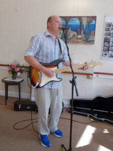 Chris White entertaining the residents at La Fontana