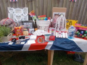 Raffle prizes on table at La Fontana Dementia Care Homes Party in the garden