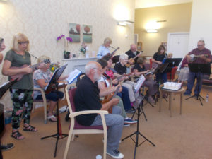 The Yeovil Ukulele Club entertaining residents and loved ones at La Fontana
