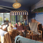 Residents at La Fontana Care Home, basking in the sunshine on their own beach sun room