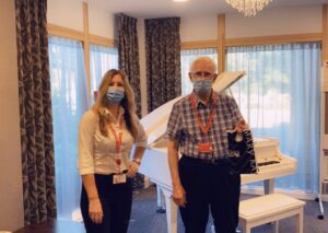 Des with Jenny, Casa administrator, with his gift from Casa di Lusso during volunteer's week